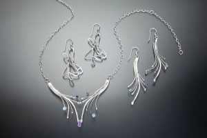 Shooting Stars Pendant. I combined blue topaz and amethyst.
