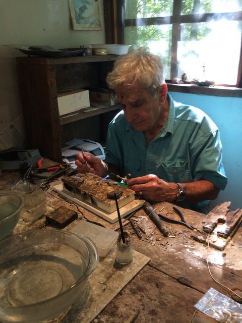 Jacques working in his shop